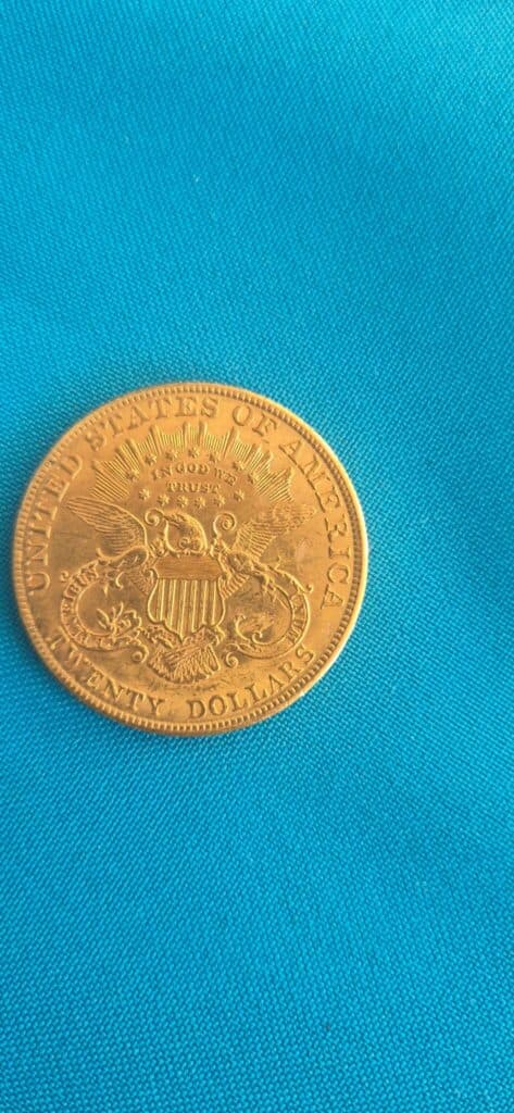 Taxatie van de waarde van een Amerikaanse gouden munt van 20 dollar uit 1907 Taxatie van de waarde van een Amerikaanse gouden munt van 20 dollar uit 1907