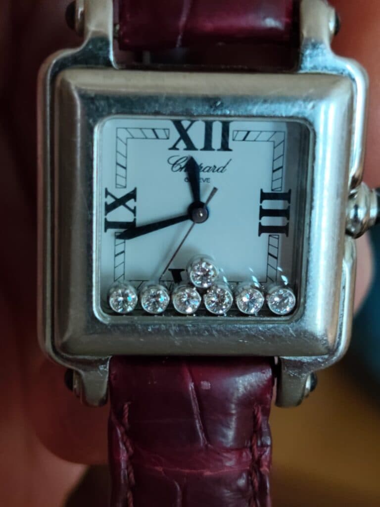 Taxatie van de waarde van een vintage Chopard Happy Sport horloge versierd met zeven diamanten.