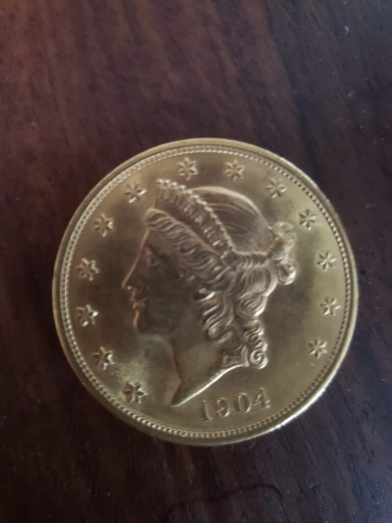 Taxatie van een authentiek Amerikaans gouden munt uit het jaar 1904